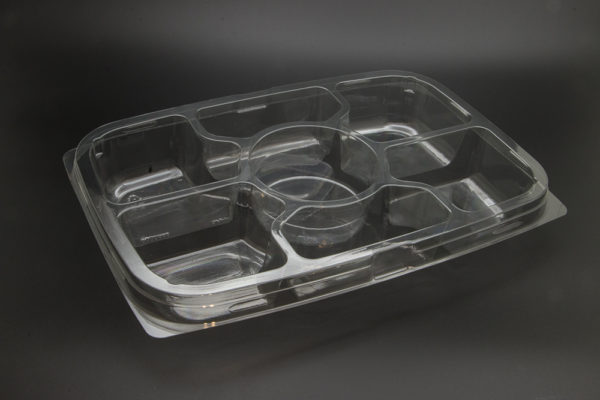 A clear plastic tray with four compartments.