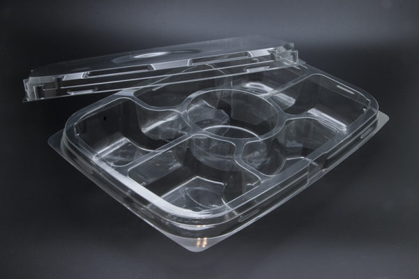 A clear plastic container with four compartments.