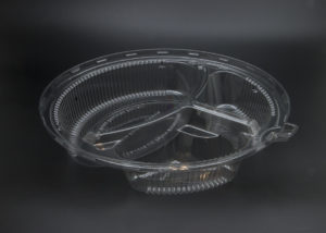 A clear plastic bowl on a black background.