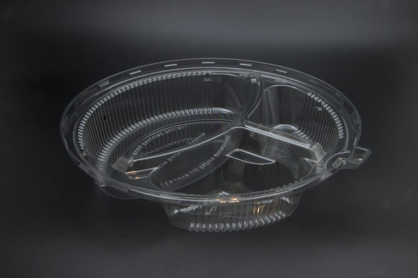 A clear plastic bowl on a black background.