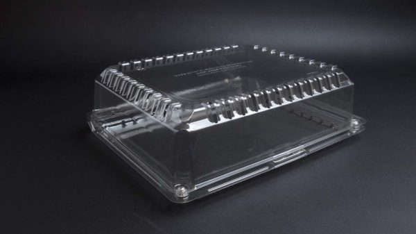 A clear plastic box on a black surface.