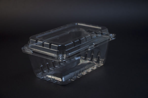 A clear plastic container on a black background.